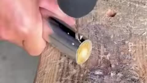 Craftsman makes a dust brush from bamboo