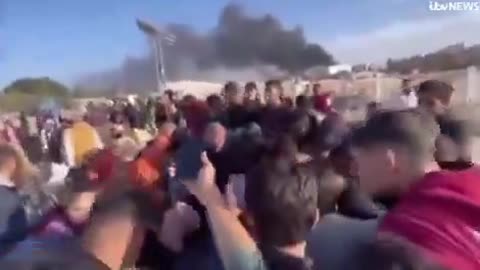 ITV interviews a man in a group waving a white flag at Israeli forces in Gaza get shot at.