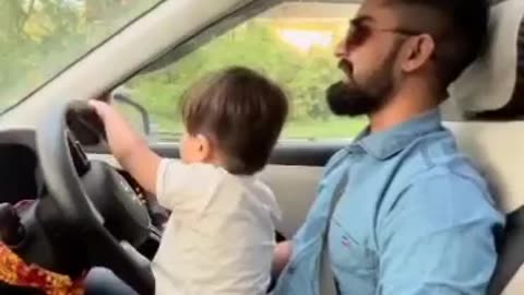 Two years cute boy driving a car 🚗