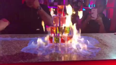 Epic Bar Trick: Watch as Bartender Sets Shots Ablaze in Fiery Pyramid! - Zhot Shotz