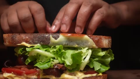 Ultimate BLT Bacon Lettuce & Tomato Sandwich on Homemade Sourdough Bread with a Runny Egg Yolk