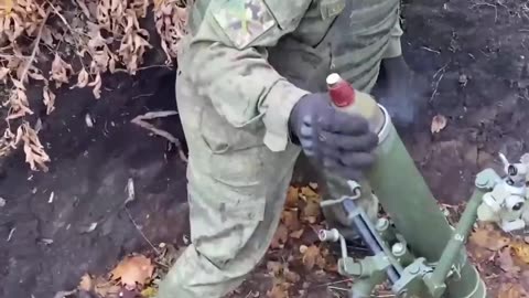 Crew of the 82-mm Tray mortar performing fire missions