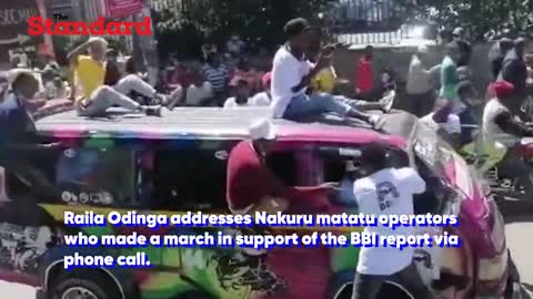Raila Odinga addresses Nakuru matatu operators via phone call as they vow to support the BBI report