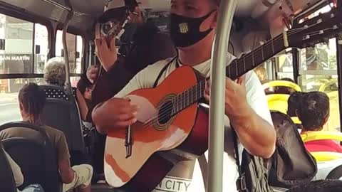 Hotel California song with acoustic guitars on a bus, Montevideo