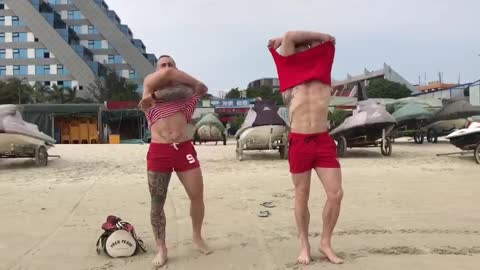muscle boys running along the beach