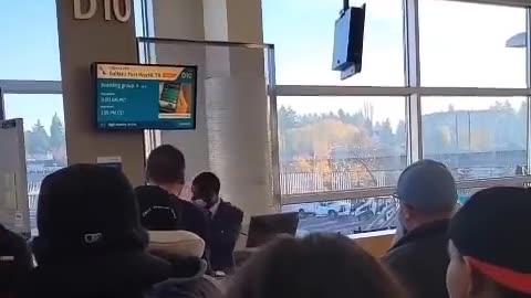 Man screaming “race war” while doing the Nazi salute at an airport in Seattle