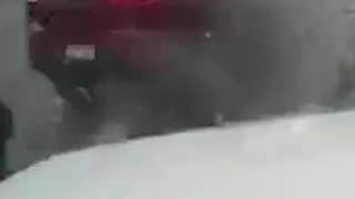 The moment a vehicle clips the corner of a snow plow in Ohio and spins off the road