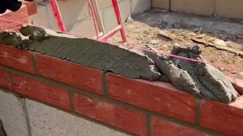 Laying bricks on a beautiful sunny day