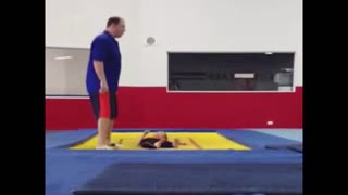 Man catches his son on trampoline