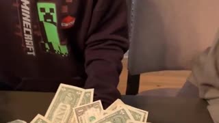 Kid Scores Big at Scoop the Money Game