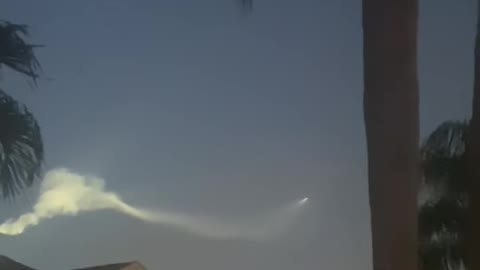 Rocket Leaving a Trail in the Sky and Forming Bubble and Oval Shapes