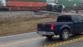 Stranded Truck Sliced in Two by Train