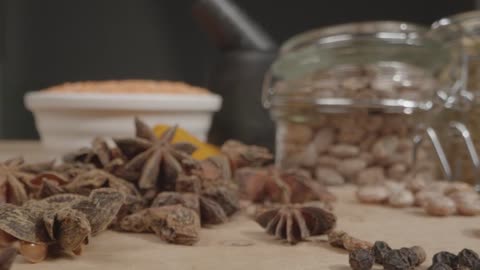 Extreme Close Up Tracking Out Shot of Spices and Grains on Table