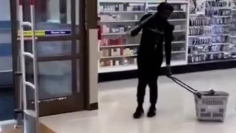 Pickaxe-Wielding Woman Caught on Video Stealing Products at LA Rite Aid