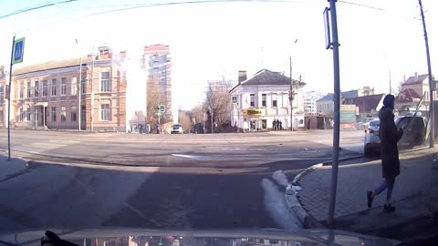 Colliding Cars Barely Miss Pedestrians