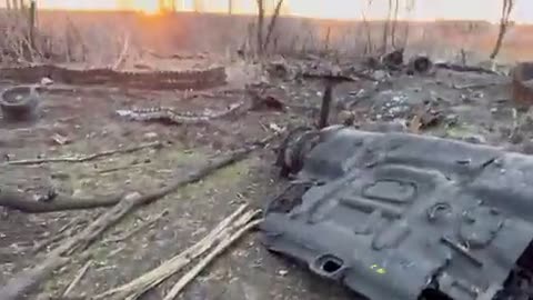 Russian serviceman showing what's left of the "Msta-S" SPG system destroyed
