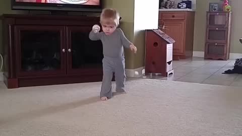 Funny kid literally keeps his eye on the ball