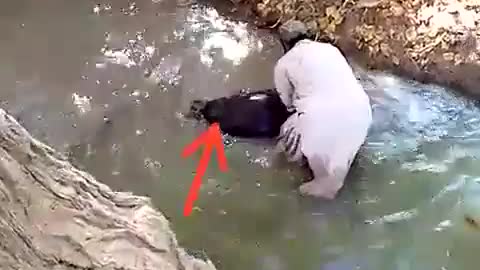 Taliban member water-boarding Afghan local