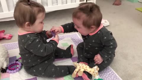 Funniest Baby girls share a pacifier