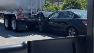 Tanker Drags Car Along Interstate
