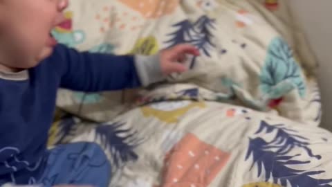 Baby cries over a toy he throws himself over and over