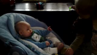 Toddler Bodhi sooths his new baby brother
