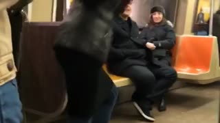 Lady in subway films herself dancing for a music video without music playing