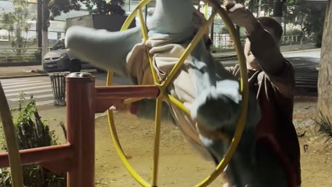 Guys Create Human Wheel of Fire WIth Playground Equipment