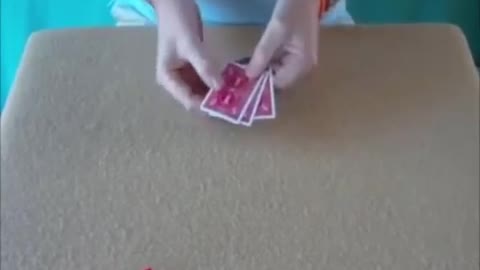 Spots Appear And Disappear From Cards Held By A Magician.