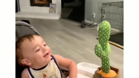 Lil baby interacting with Dancing Cactus