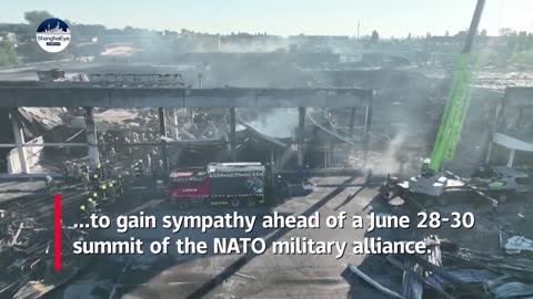 Drone footage of Ukraine shopping mall hit by missile strike showing smouldering remains