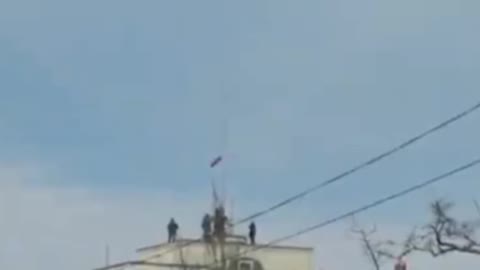 The Russian flag is raised in Kakhovka