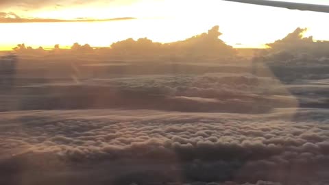 Wonderful cloud and the Sun taken on the plane.