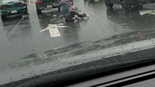 Brawl in the Rain at an Intersection