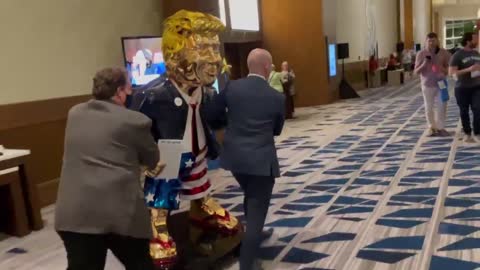 WATCH: Golden Statue of Trump Wheeled Around CPAC