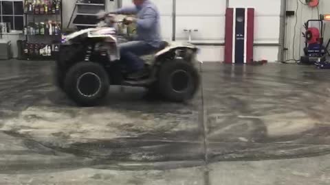 Donuts on a Four Wheeler in a Garage Doesn't go as Planned