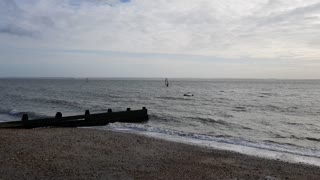 Wind surfers on a windy day. Perfect.