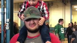 Teething toddler bites his Daddy