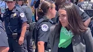 AOC Pretends To Be Handcuffed In PATHETIC Video
