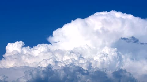 White clouds in motion in a blue sky