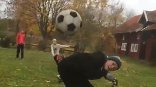Slowmo bicycle ducks kicked soccerball and it hits camera
