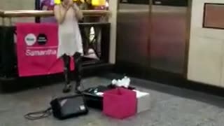 Music girl singing in front of mcdonalds subway