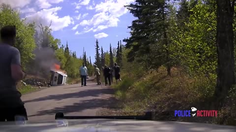 Police Dashcam Shows Dramatic Rescue Of Man From Burning SUV