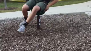 Guy at park spinning ride falls on head