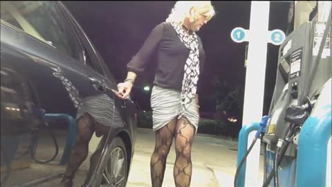 Crossdresser Fills Up At Gas Station Flashing Some Leg