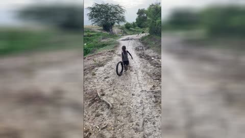 Young Boy in Haiti Creates His Own Toy