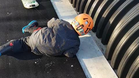 Kid goes on a snowboarding lesson, has more fun on the magic carpet