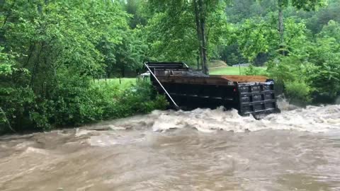 Brave Trucker Takes His Truck Over A Creek