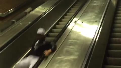 Long distance slide down escalator hand rail fail