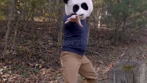 A Man silly slow motion dancing and celebrating like a panda